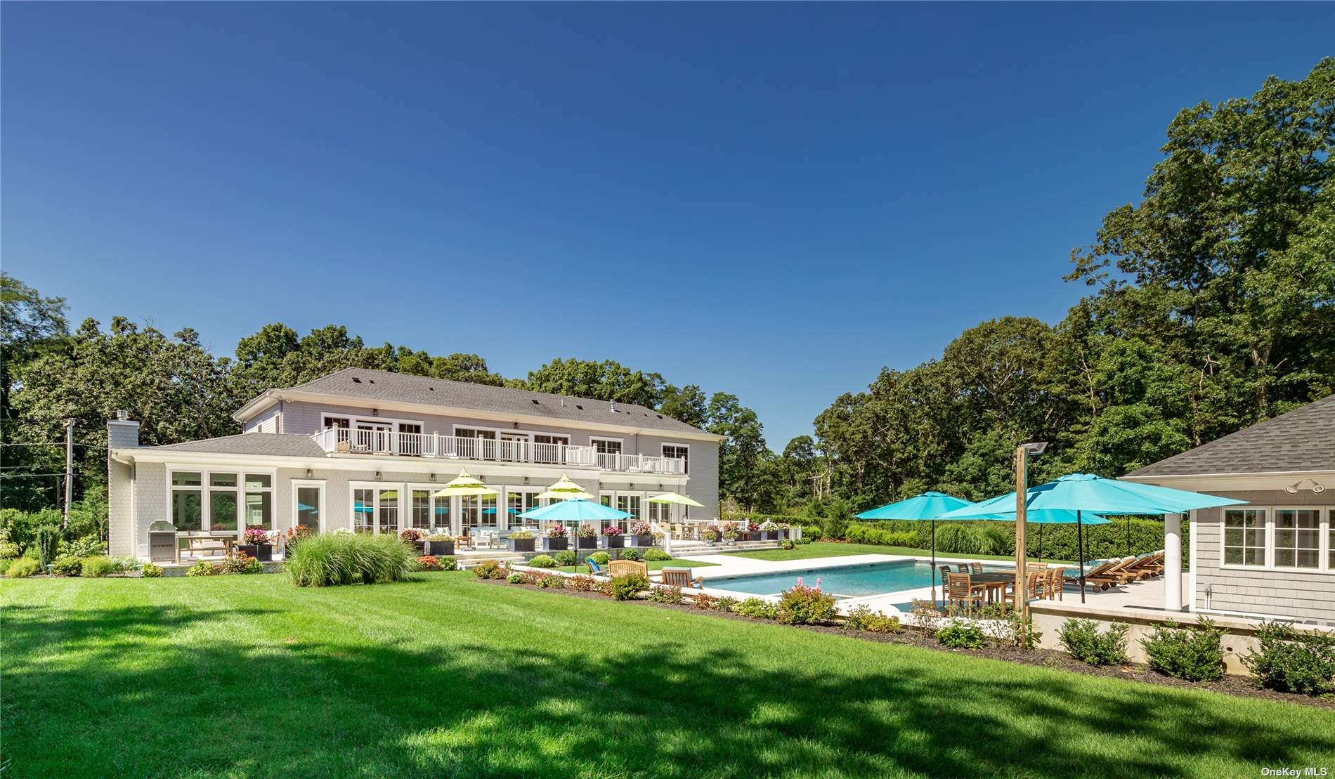 a view of a house with garden and a patio