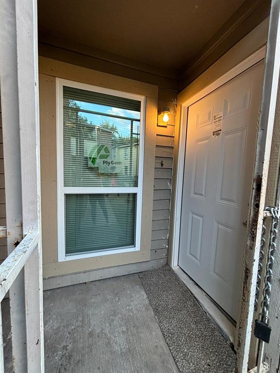 a view of entryway with wooden floor