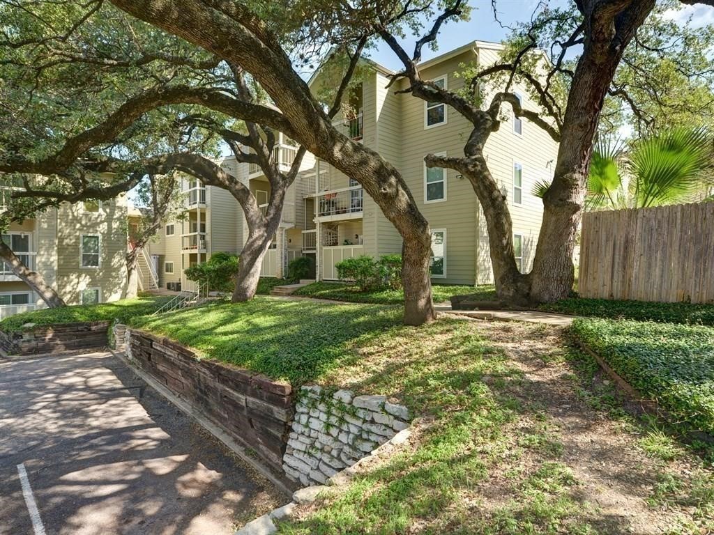 a backyard of a house with lots of green space