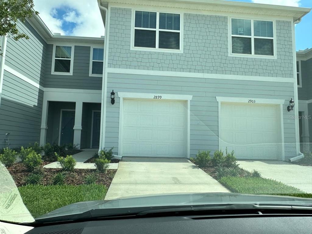 a front view of a house having yard