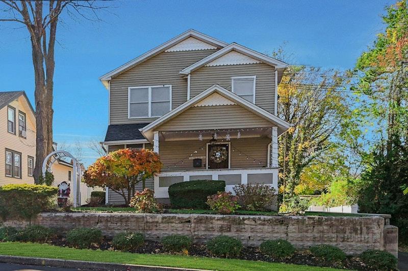 a front view of a house with a yard