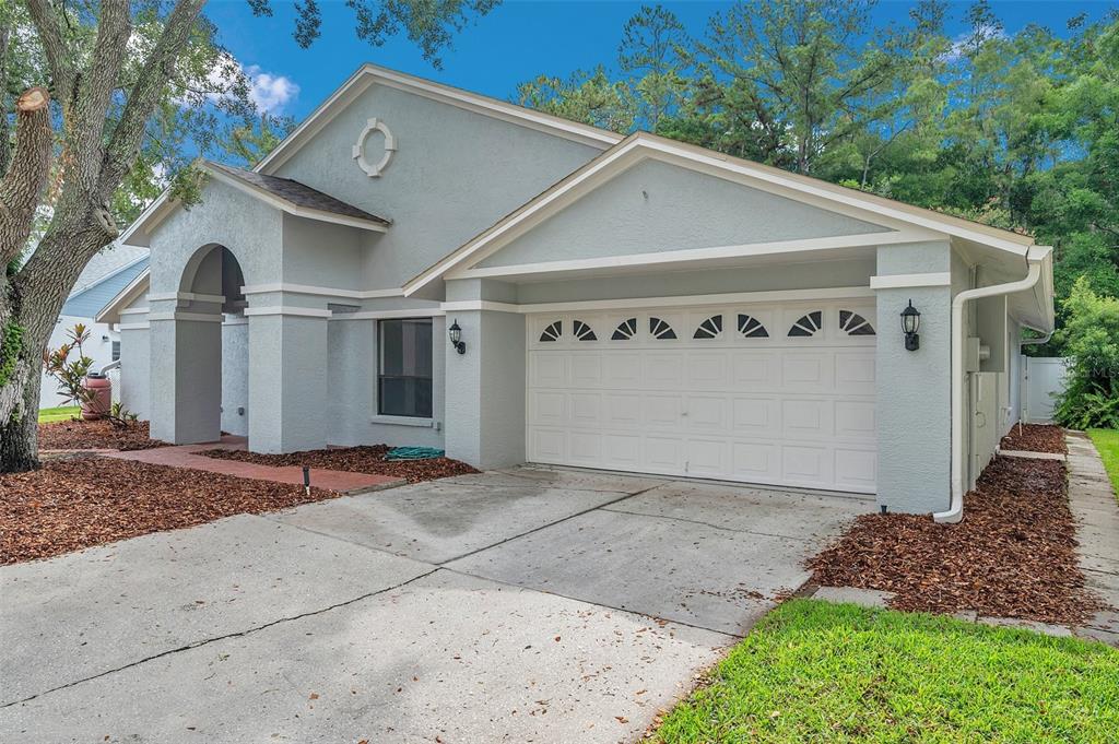 a front view of a house with garage