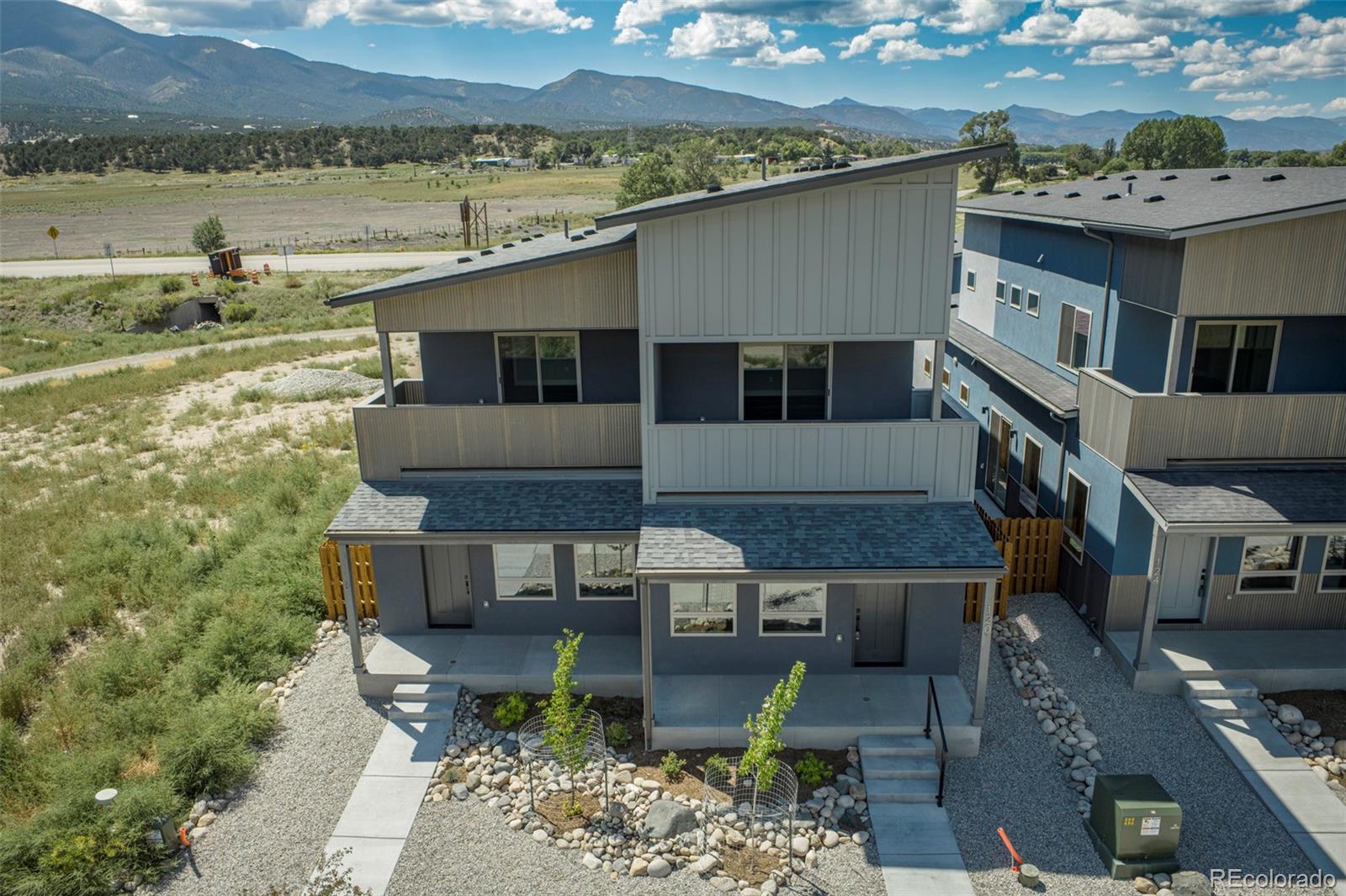 an aerial view of a house with lake view