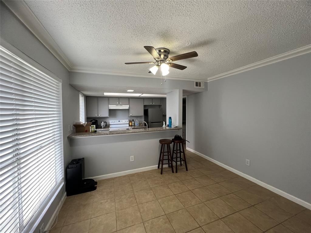 a view of kitchen with cabinets