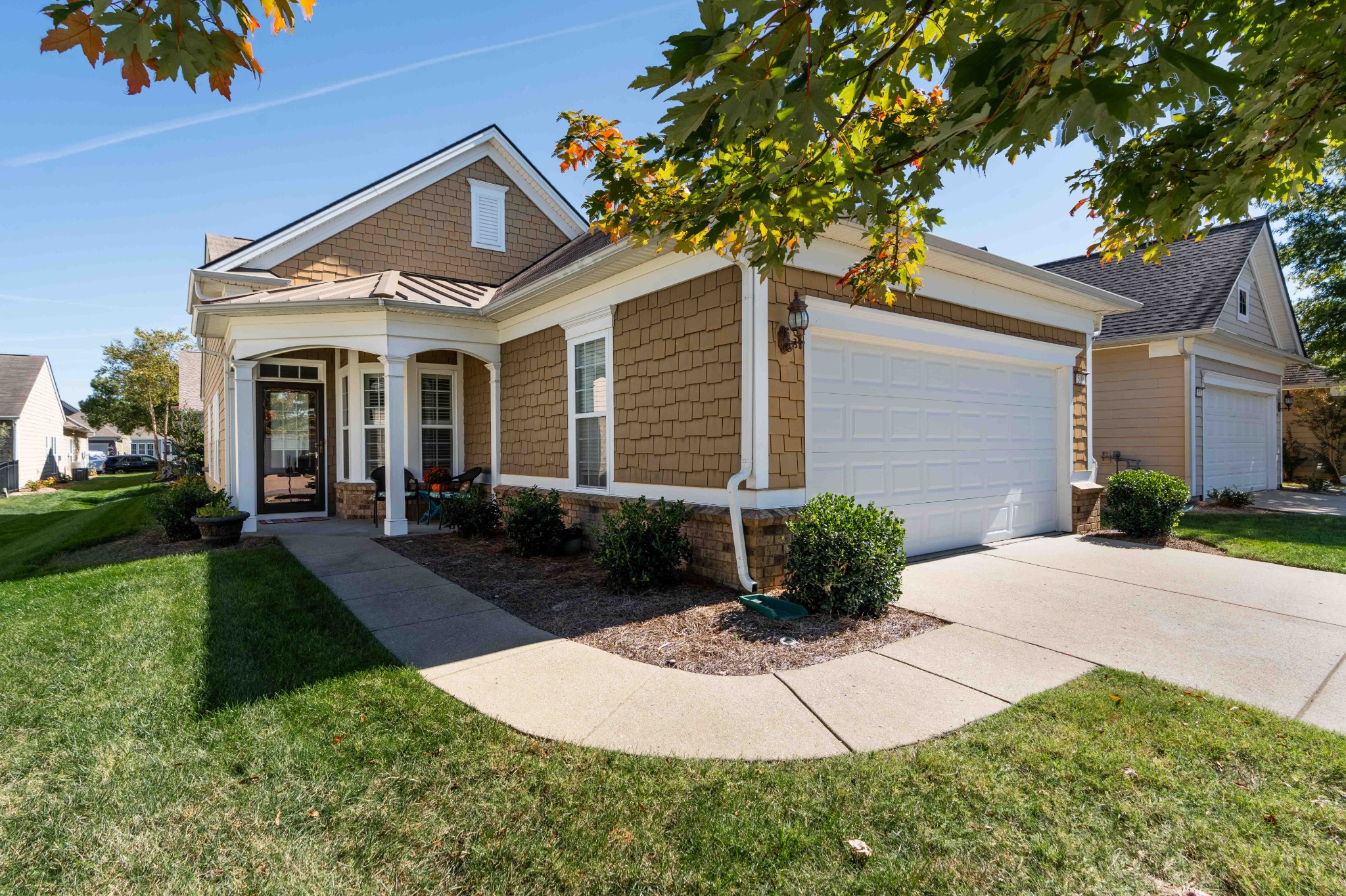 a front view of a house with garden