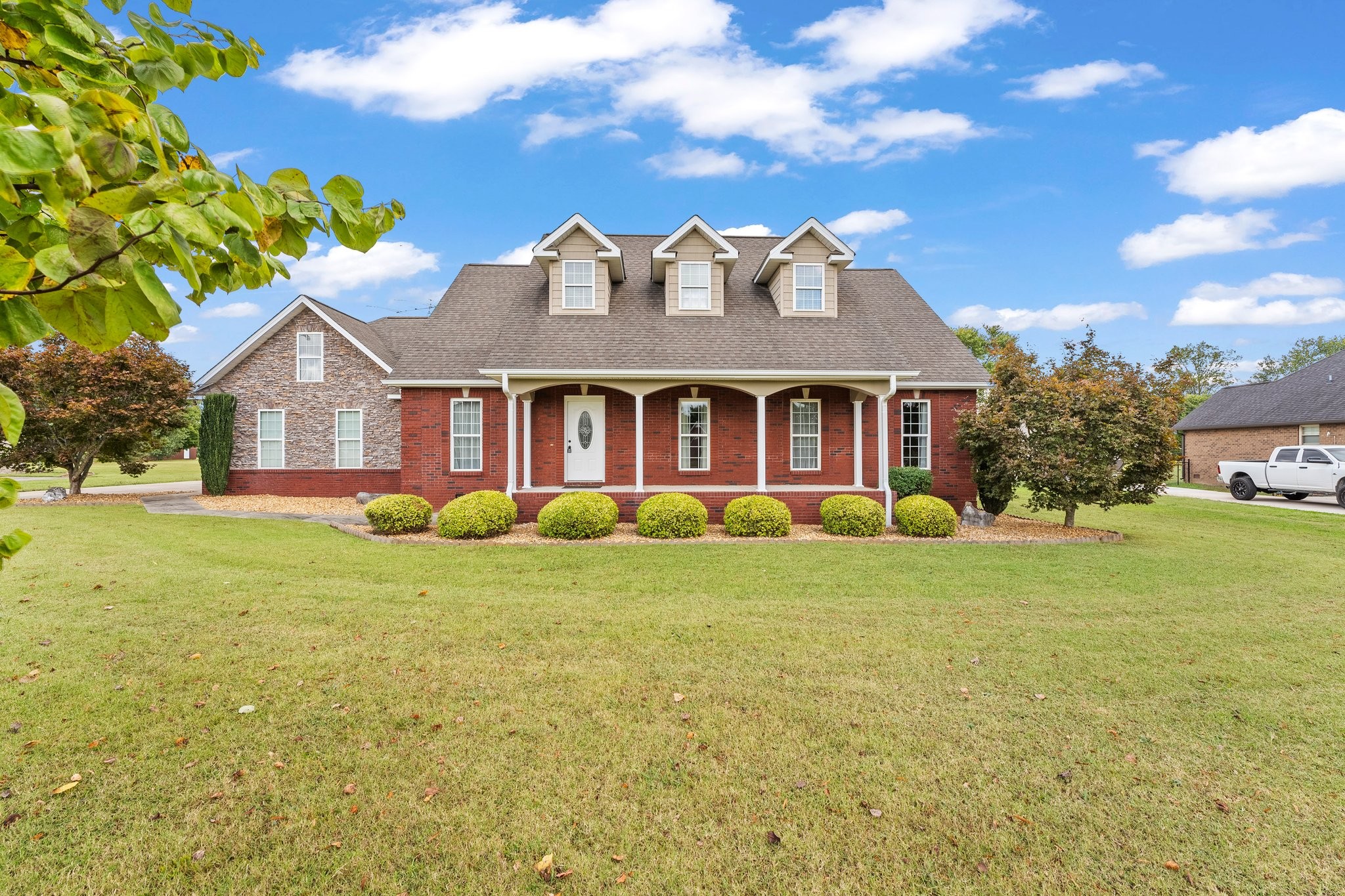 a view of a house with a backyard