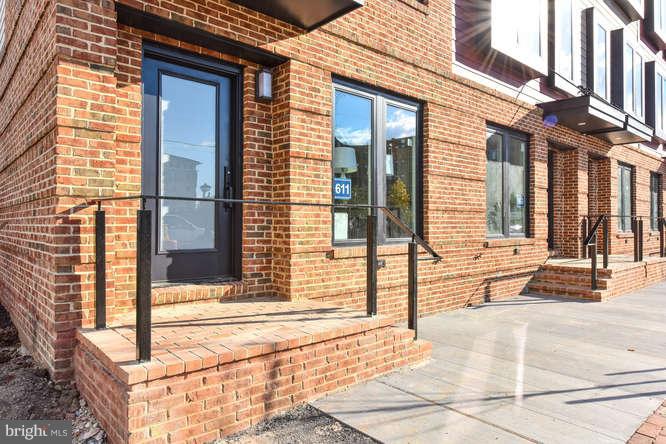 a view of a brick building with large windows