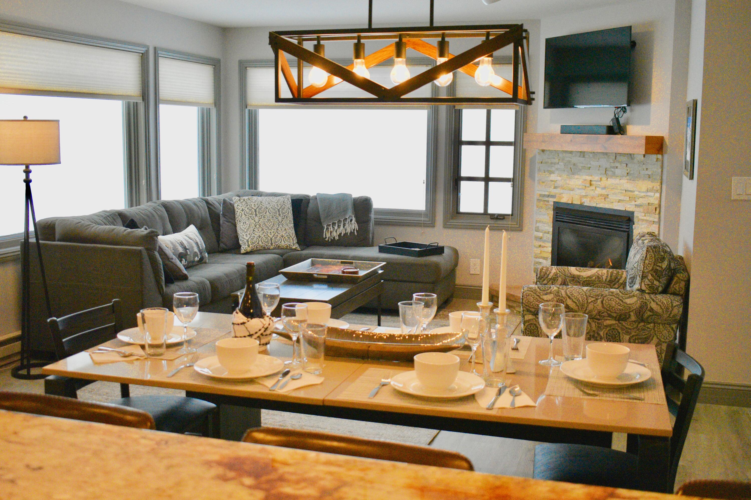 a living room with furniture fireplace and a flat screen tv