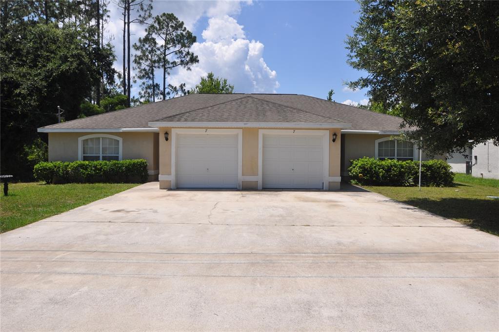 a view of outdoor space yard and garage