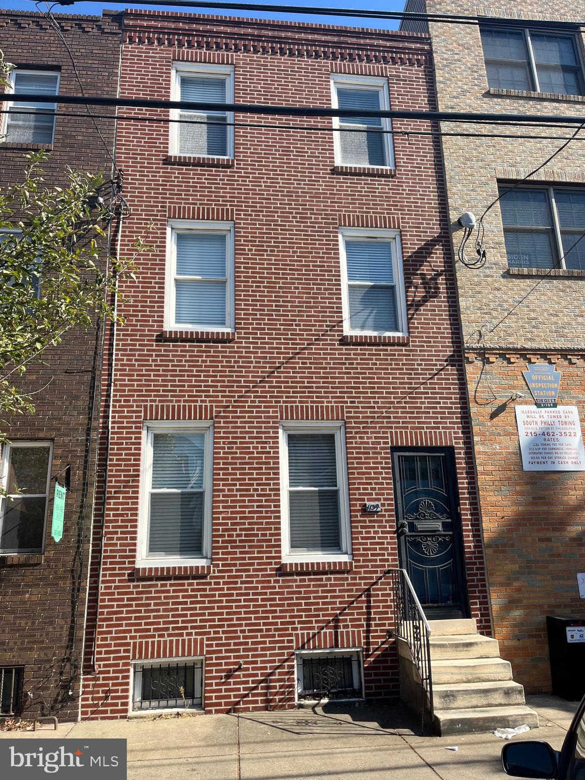 a building view with a brick wall