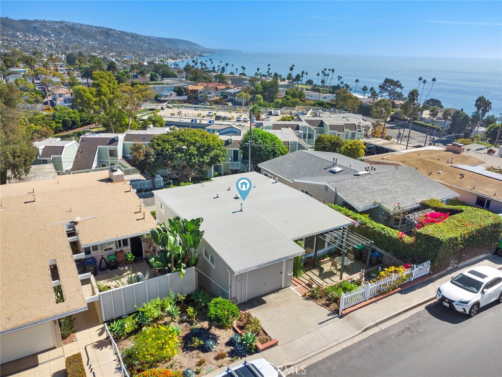 an aerial view of a house with a garden