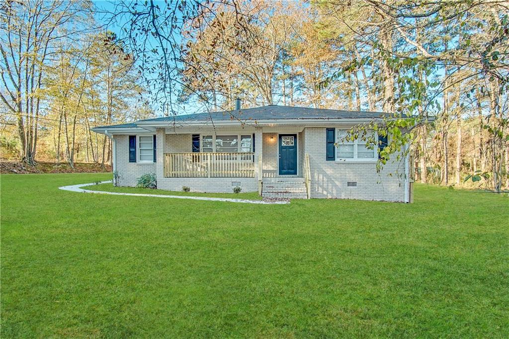 front view of a house with a yard