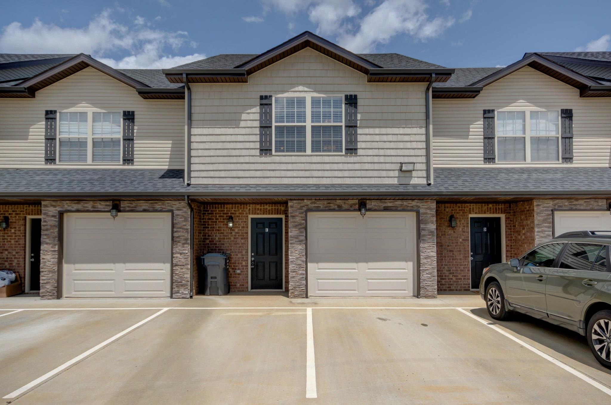 a view of a car parked in front of a house