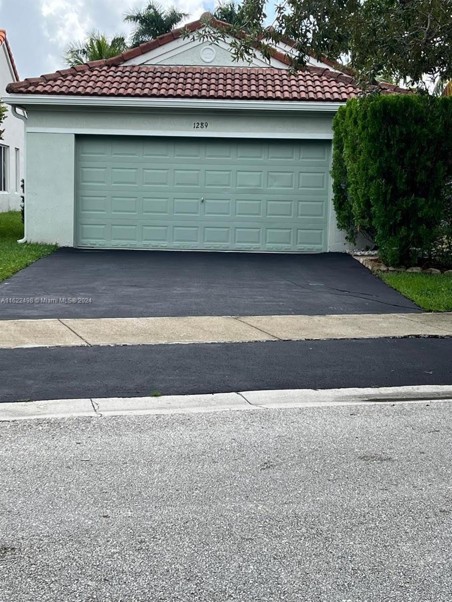 a view of a house with a garage