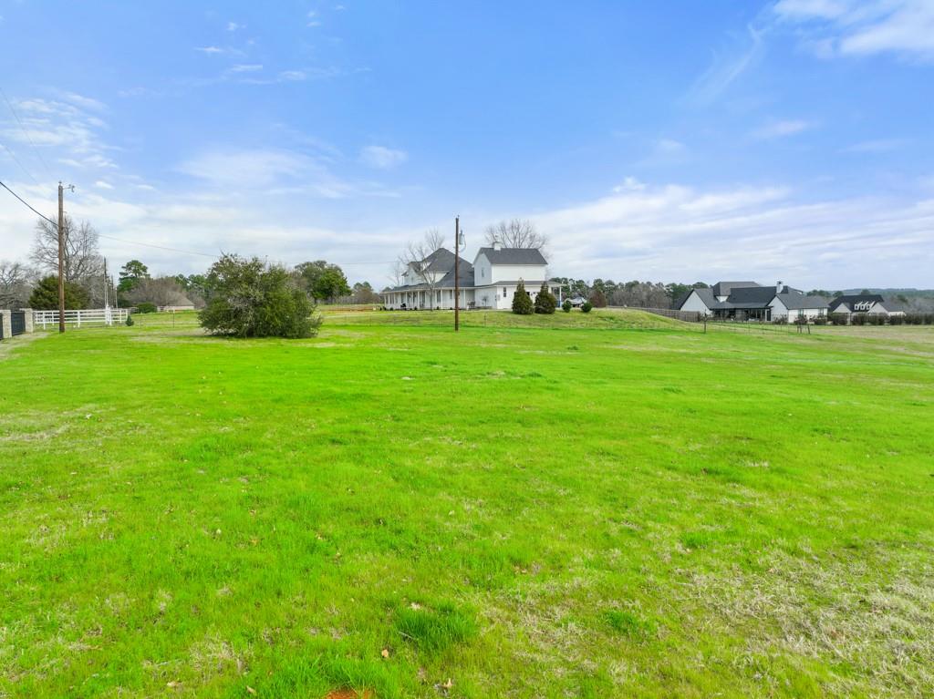 a view of a golf course with green space