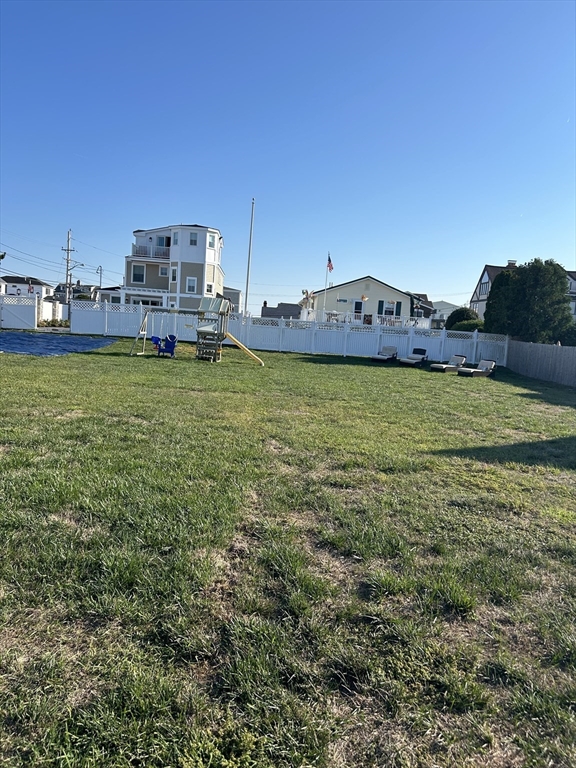 a view of a big house with a big yard