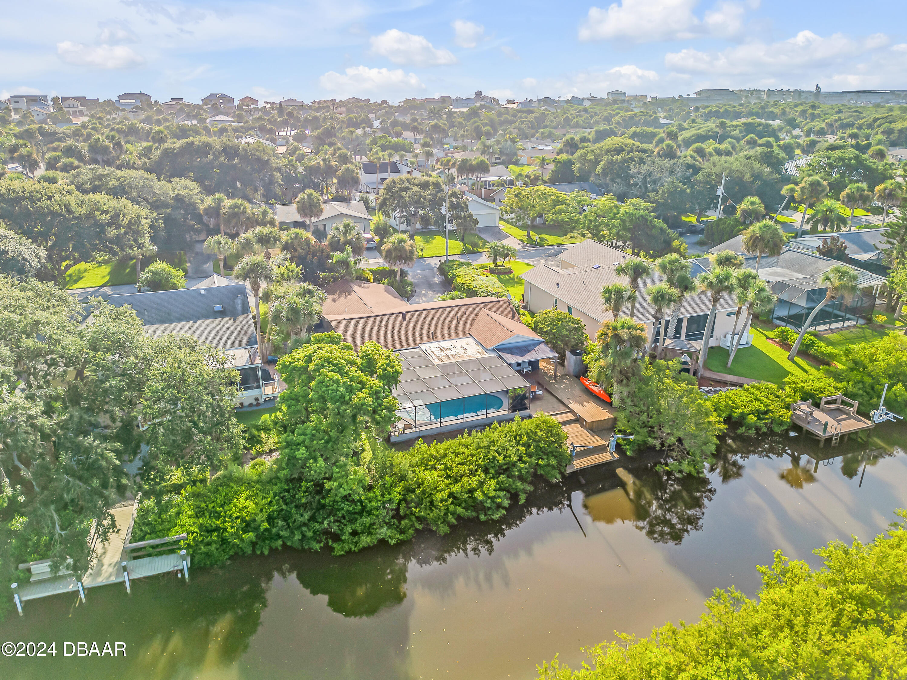 an aerial view of residential house with outdoor space and lake view