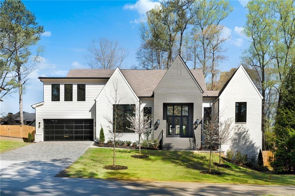 a front view of a house with a yard patio and fire pit