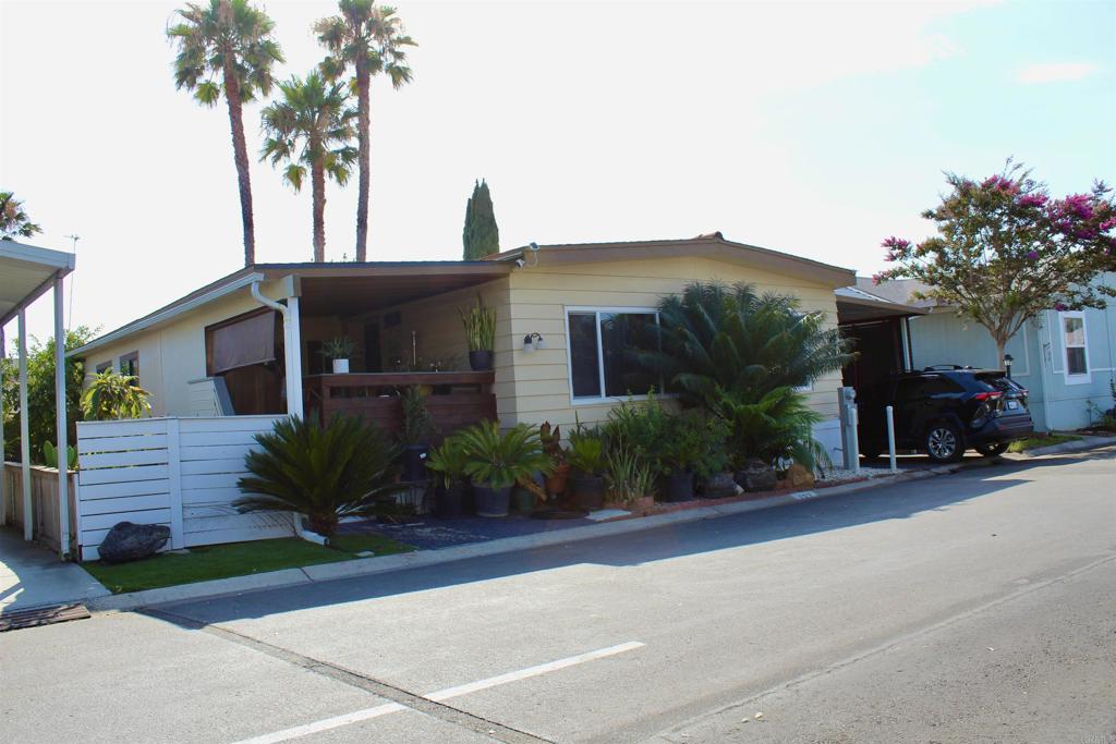 a front view of a house with a yard and a garage