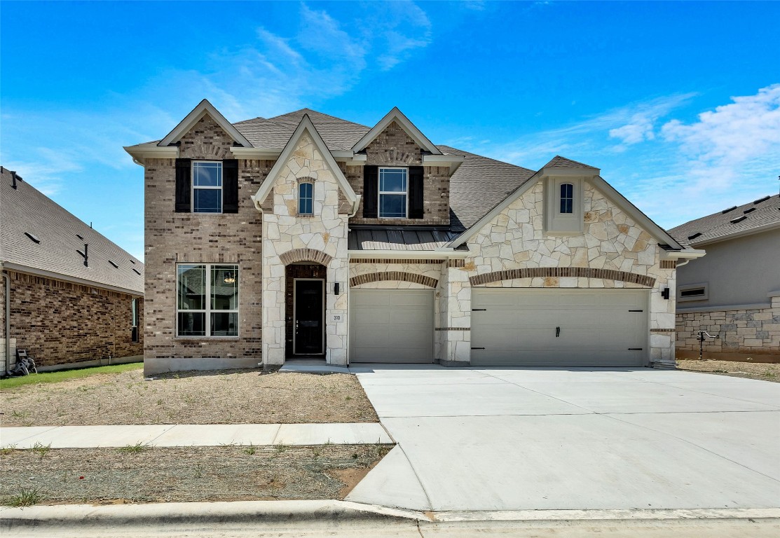 a front view of a house with a garage