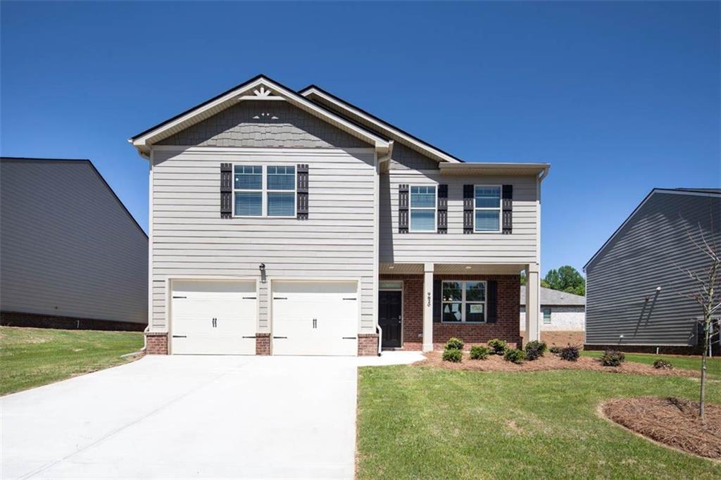 a front view of a house with a yard