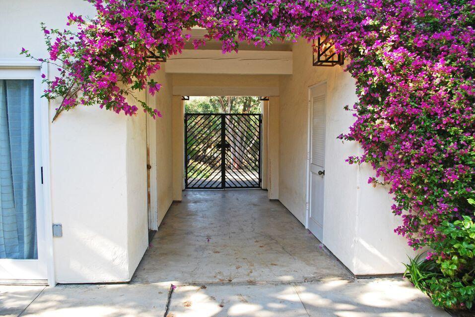 a view of a house with a flower garden