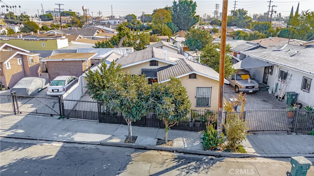 a aerial view of a house with garden space and street view