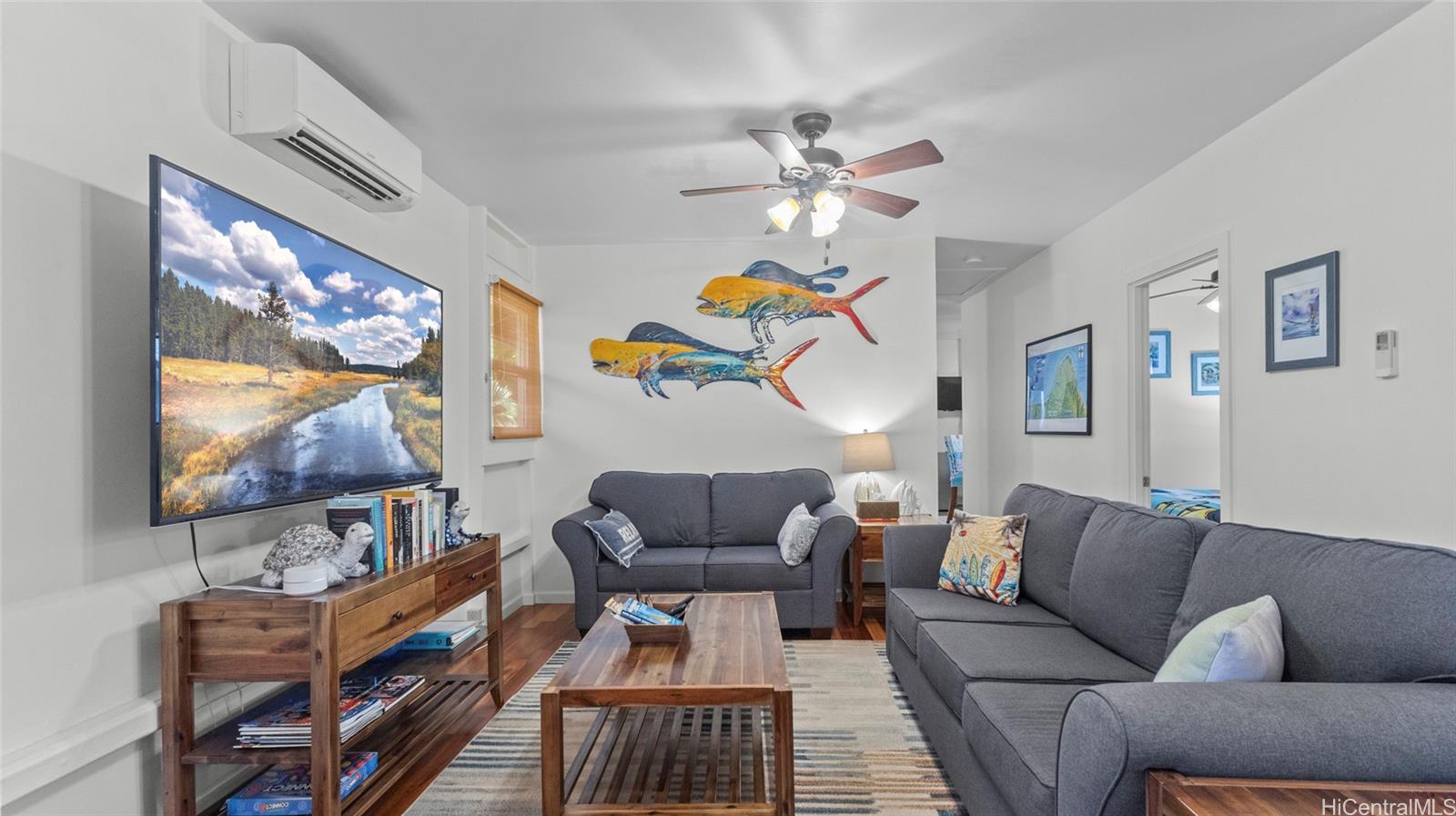 a living room with furniture and a flat screen tv