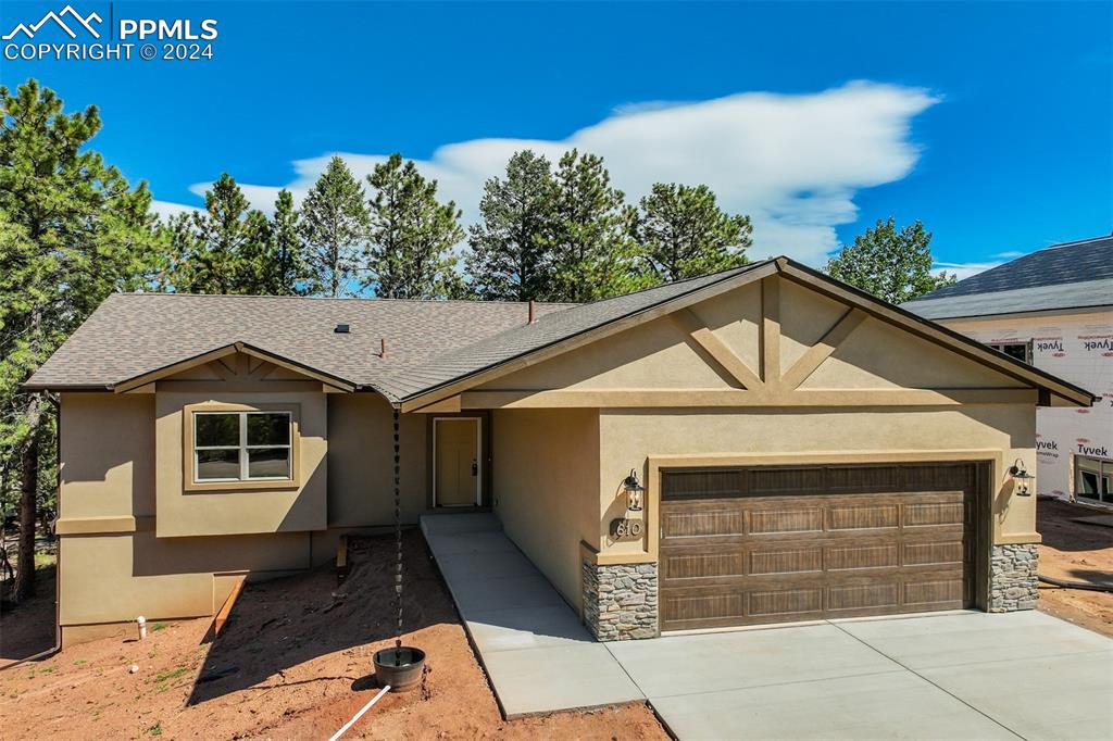 a front view of a house with a garage