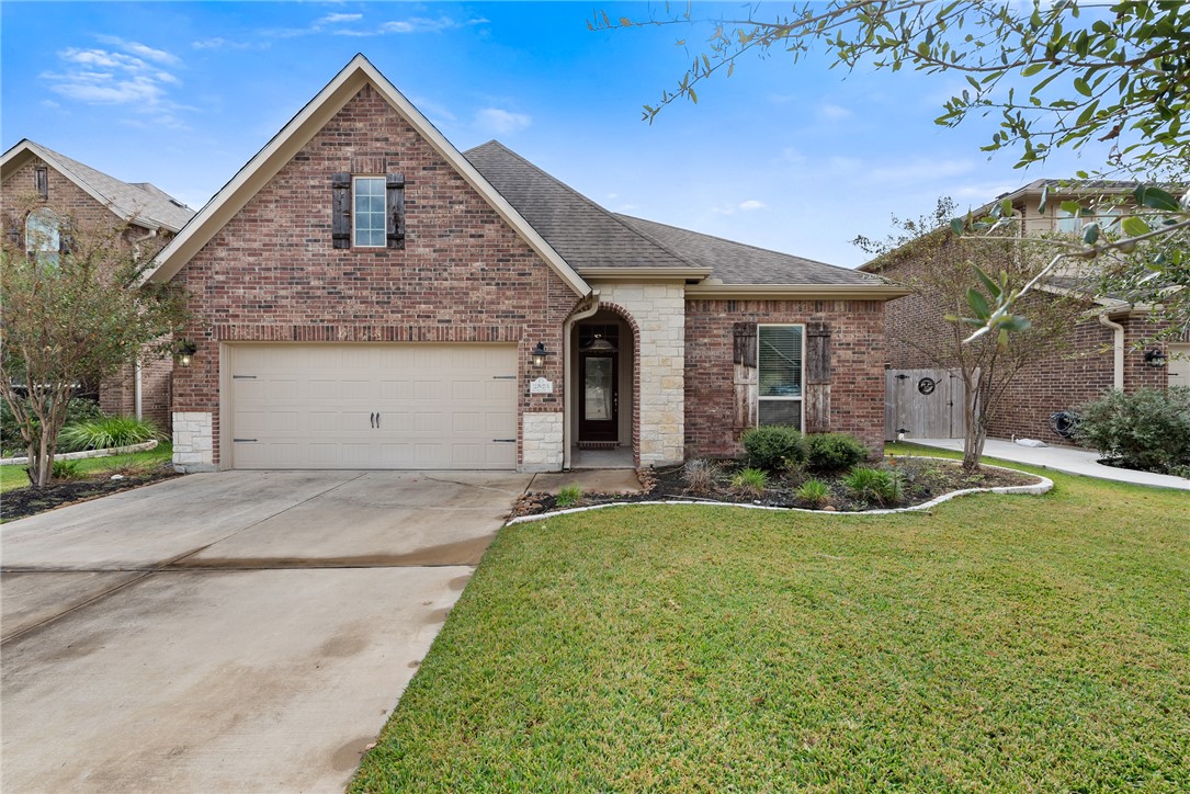 View of front property featuring a garage and a fr