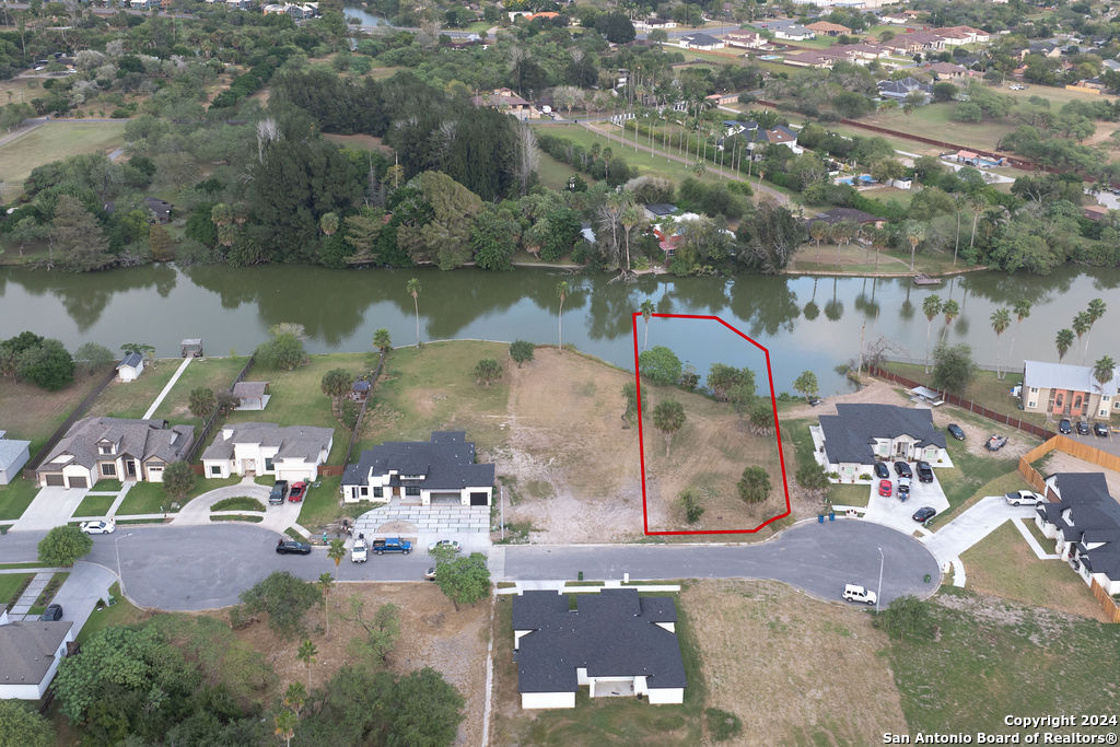 an aerial view of a houses with outdoor space