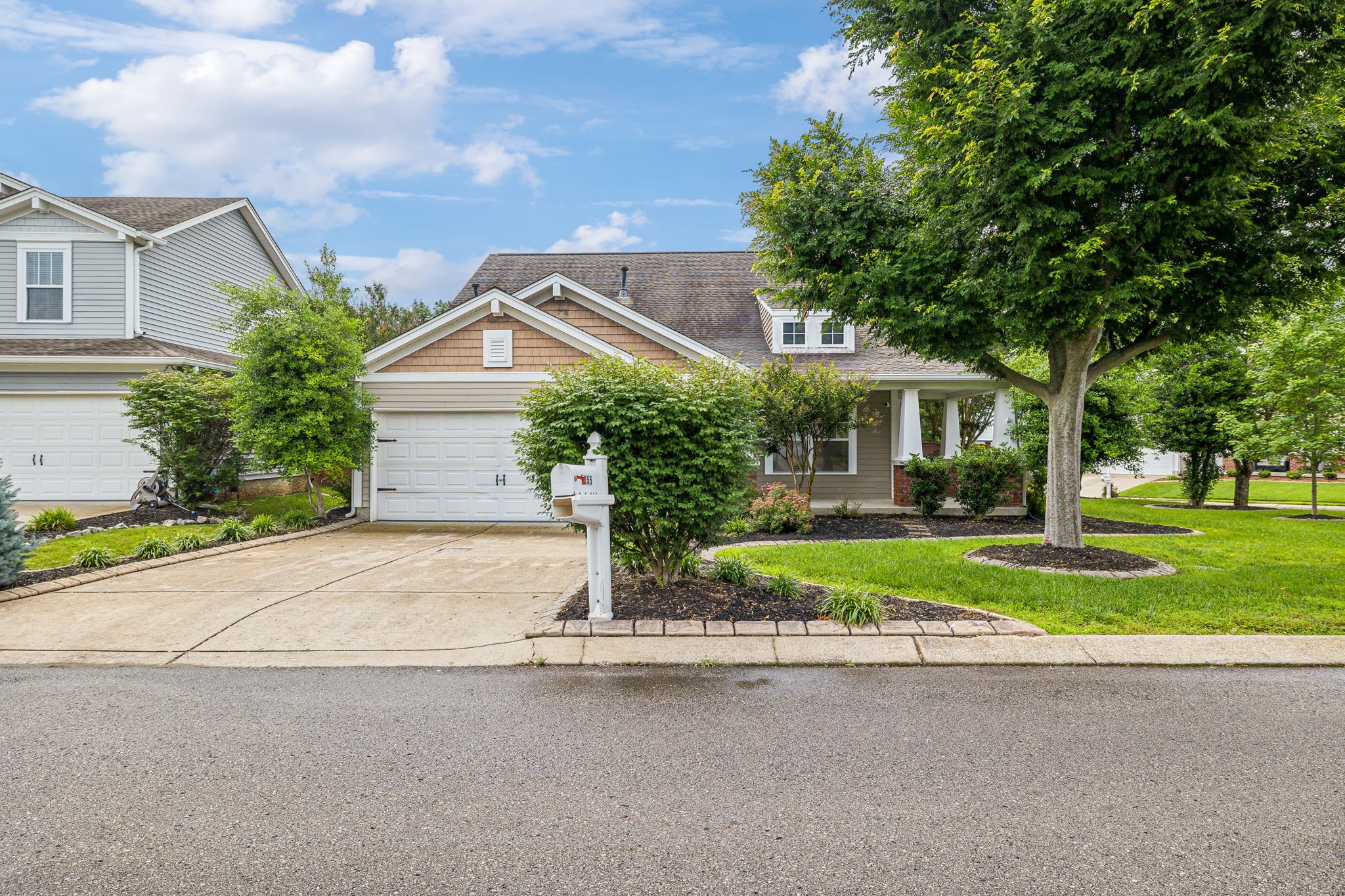 a front view of house with yard and green space