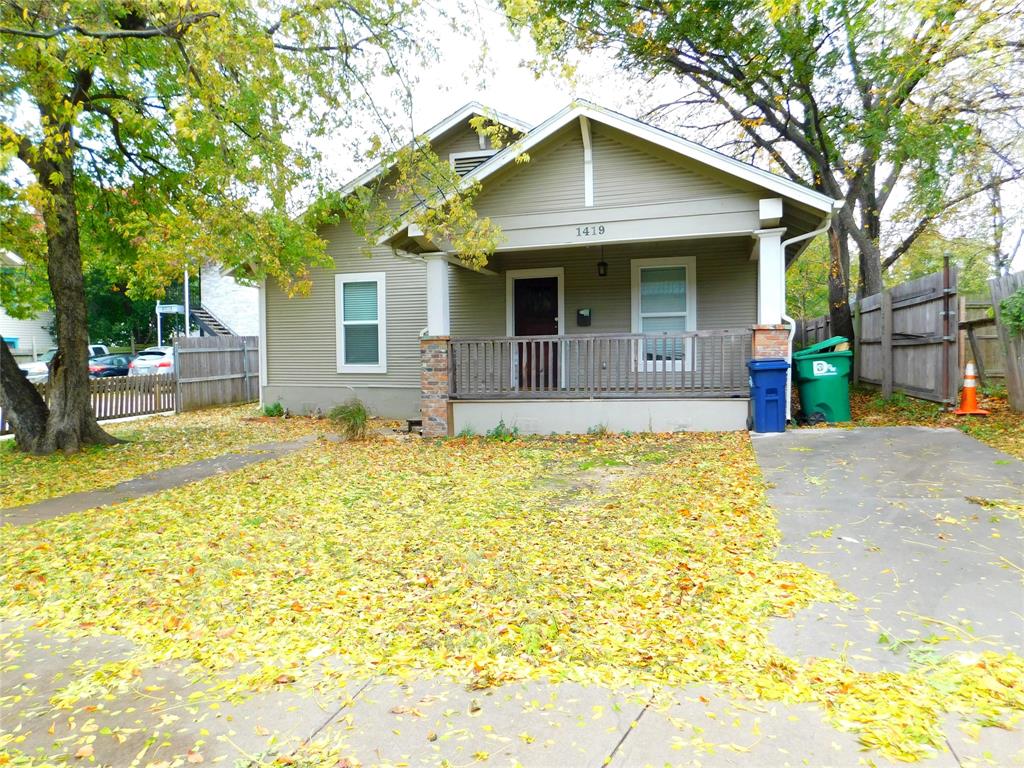 a front view of house with yard outdoor seating and barbeque oven