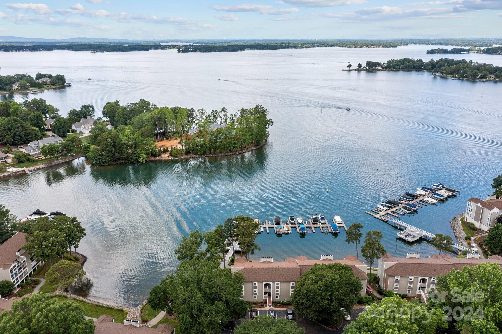 an aerial view of a house with a lake view