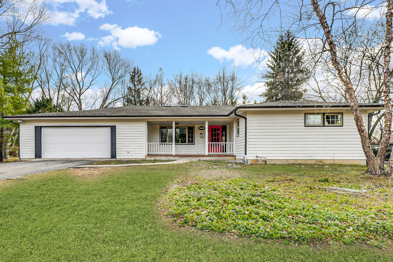 front view of a house with a yard