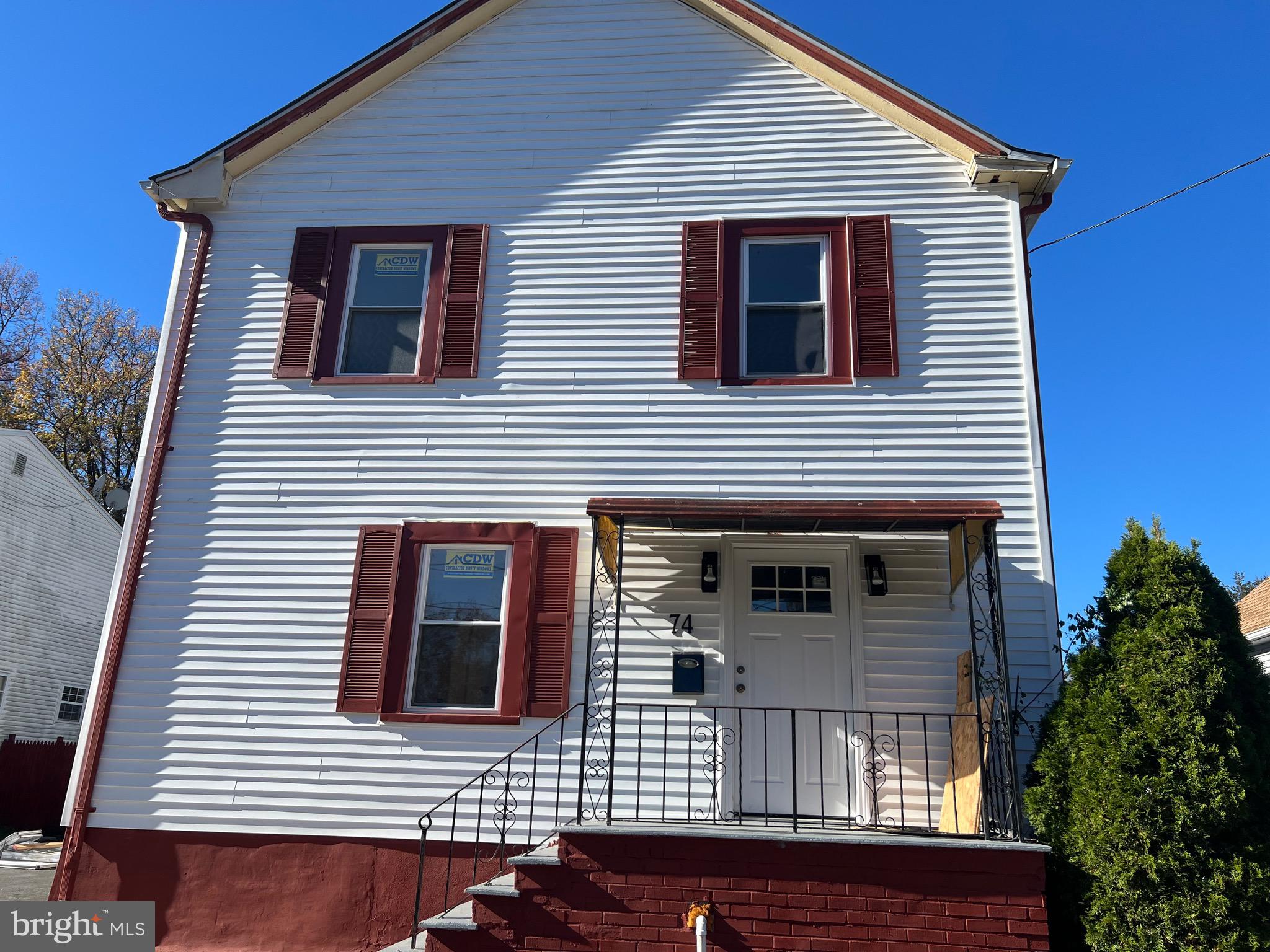 a view of a house with more windows and garage