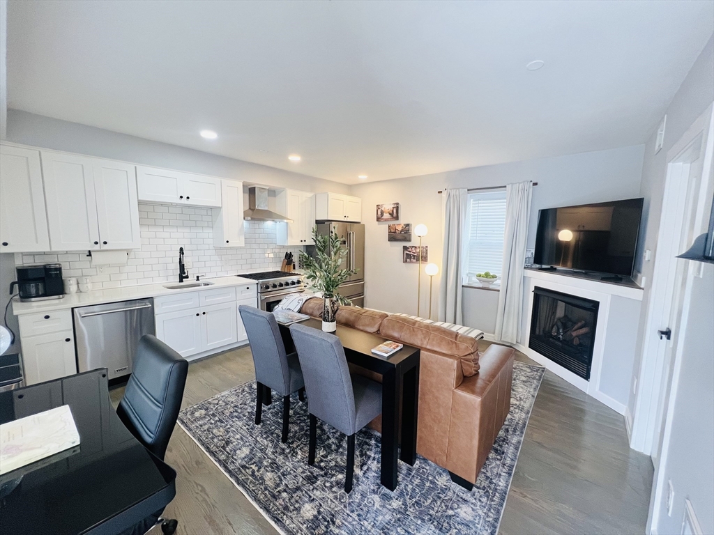 a view of kitchen with dining table and chairs