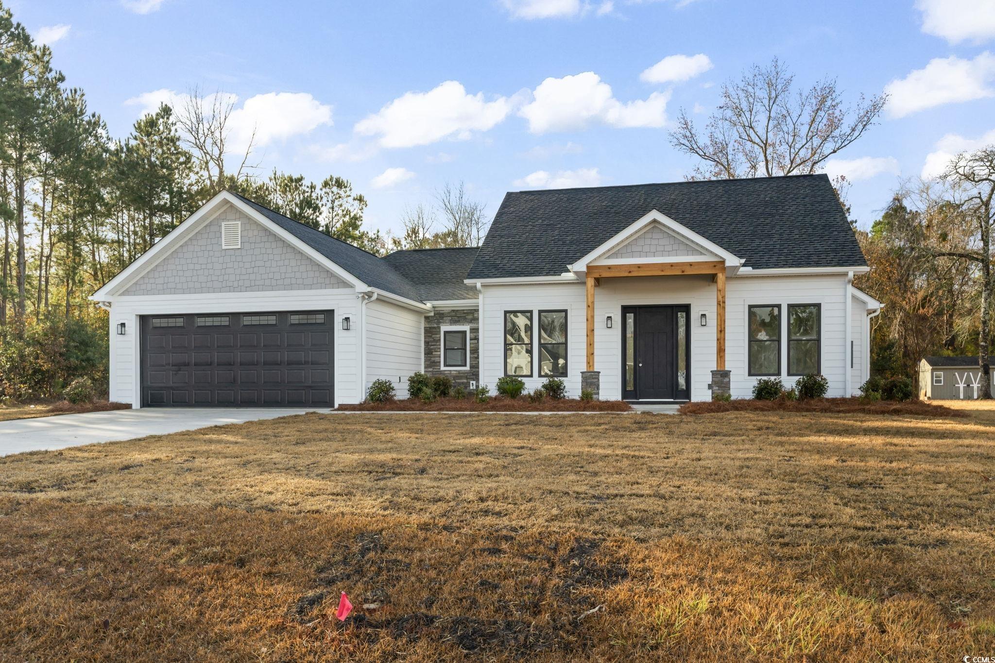 View of front of house featuring a front yard and