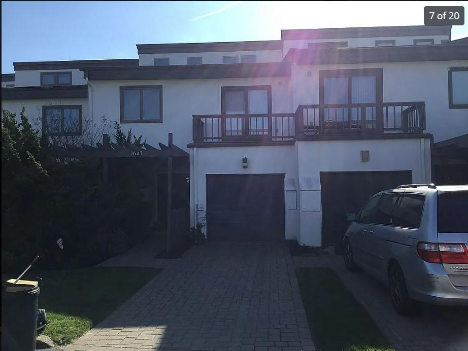 a front view of a house with outdoor space