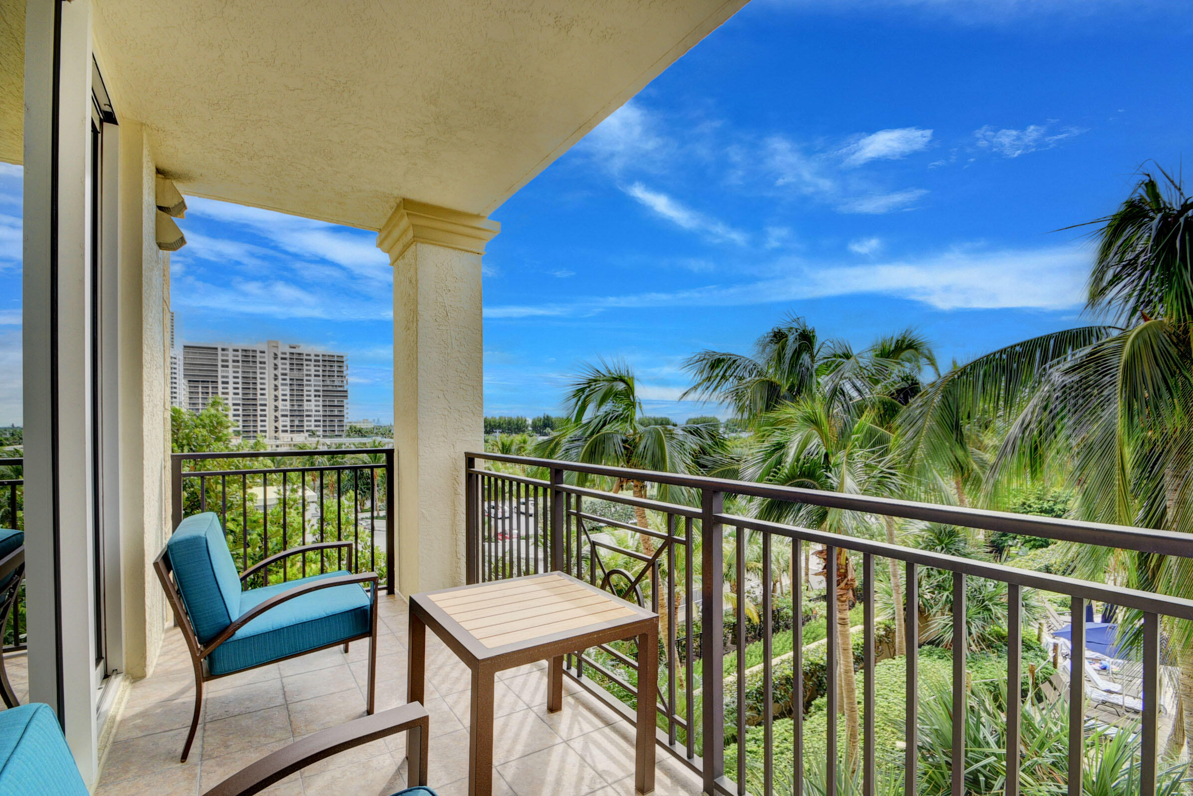 a view of a balcony with furniture