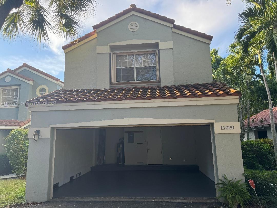 a front view of a house with yard