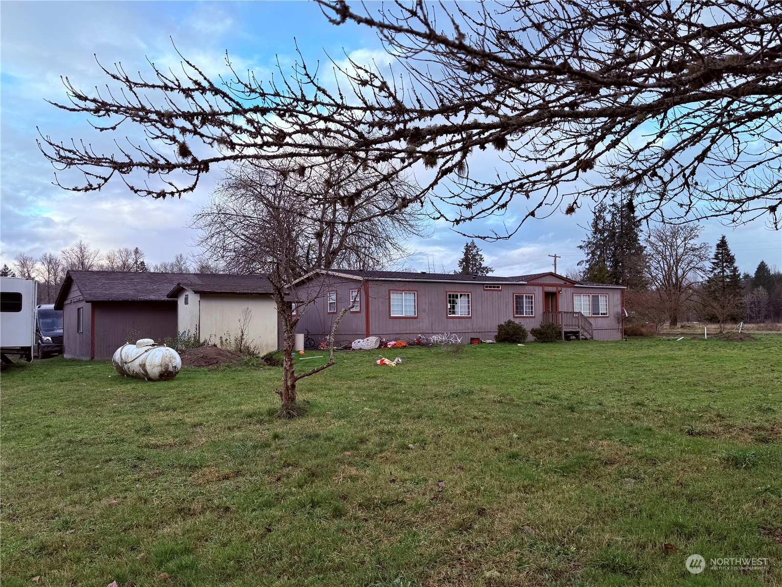 a view of an house with backyard space and garden