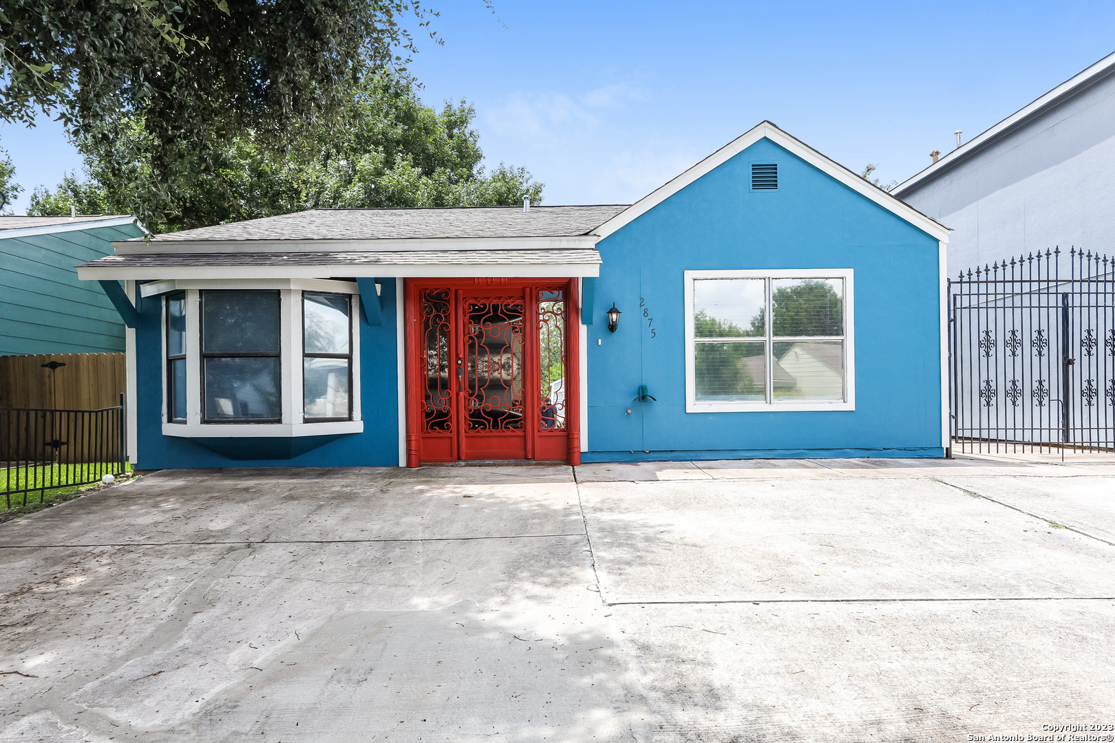 a front view of a house with yard