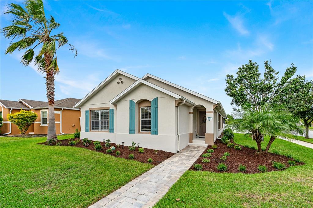 a front view of house with yard and green space