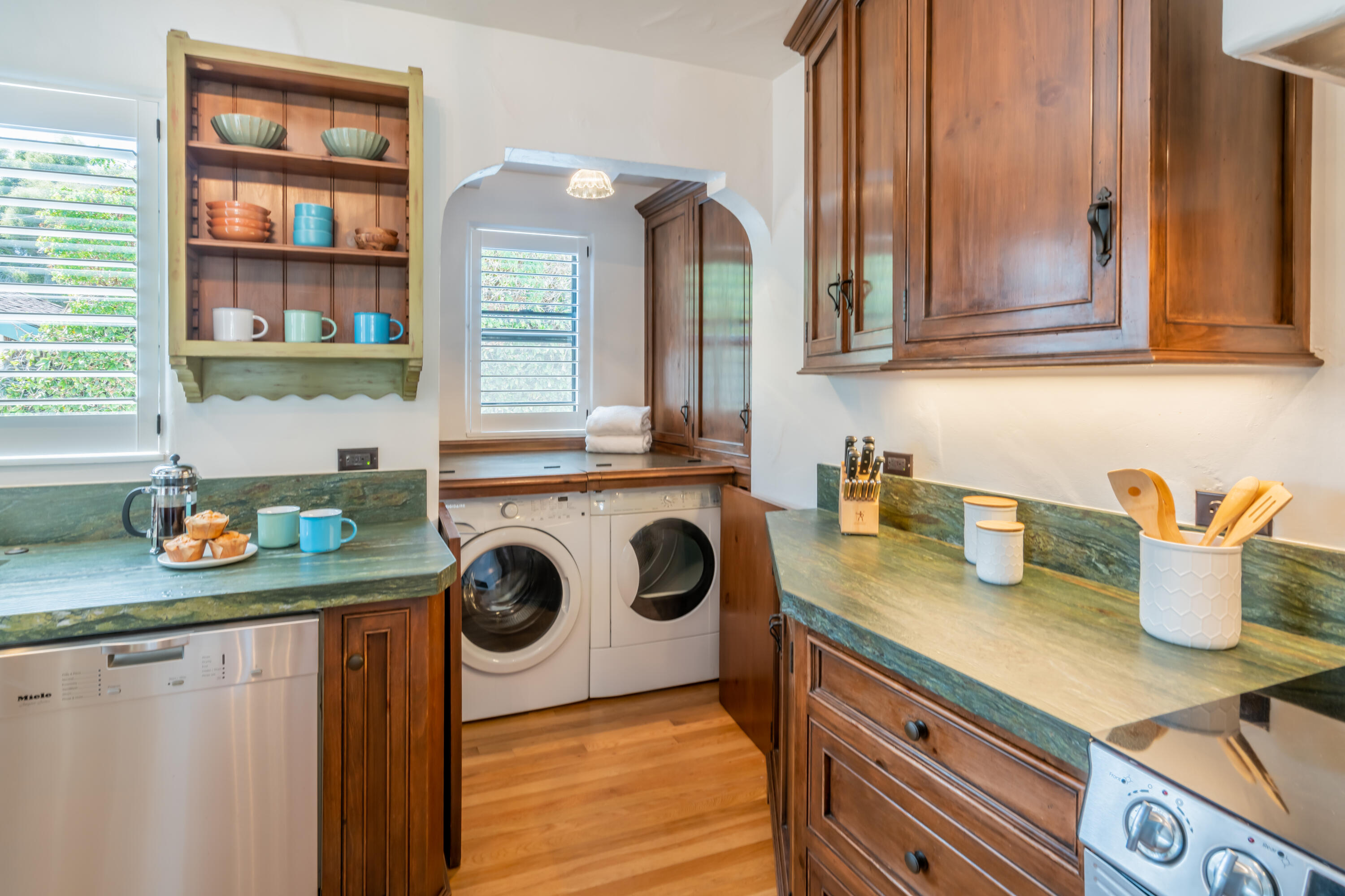 a kitchen with a refrigerator and a stove