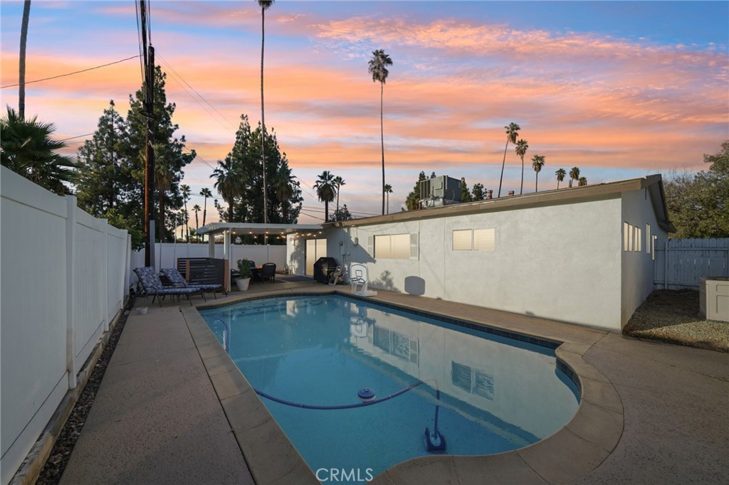 a view of a swimming pool with a lake view