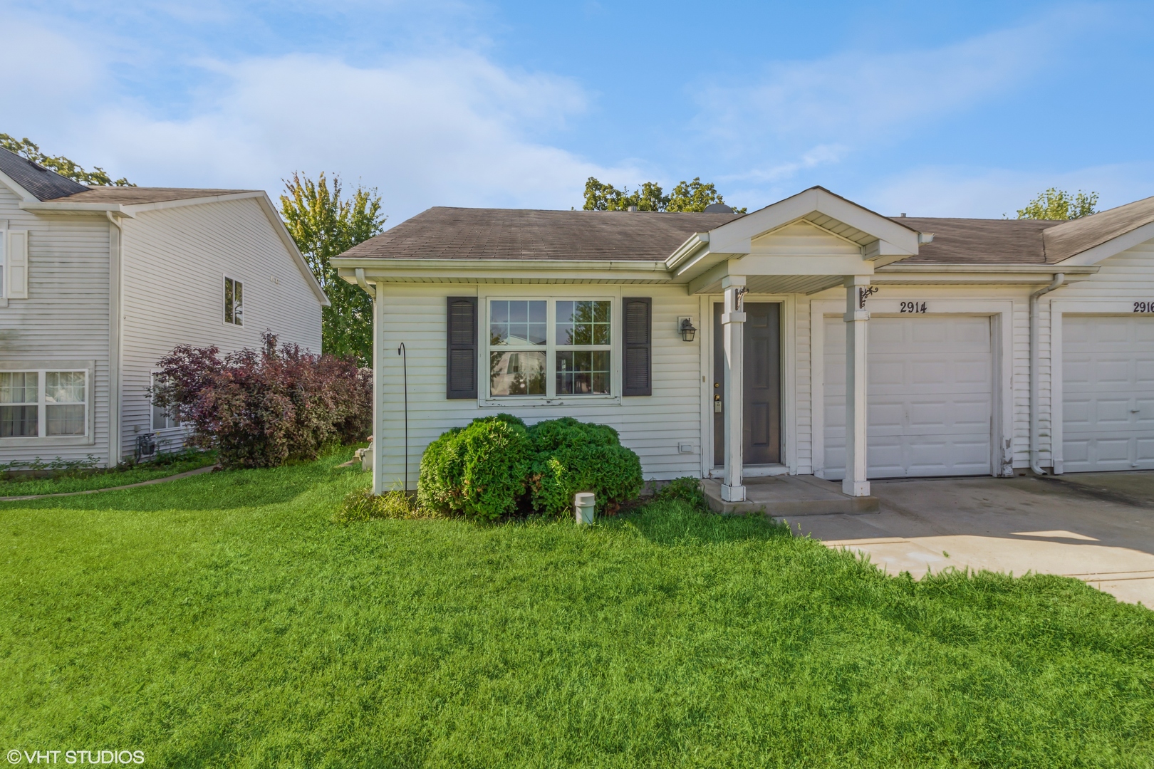 front view of a house with a yard