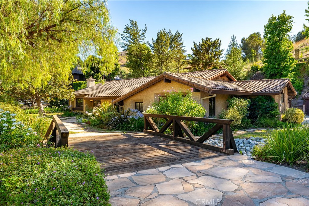 a view of a bench in front of house