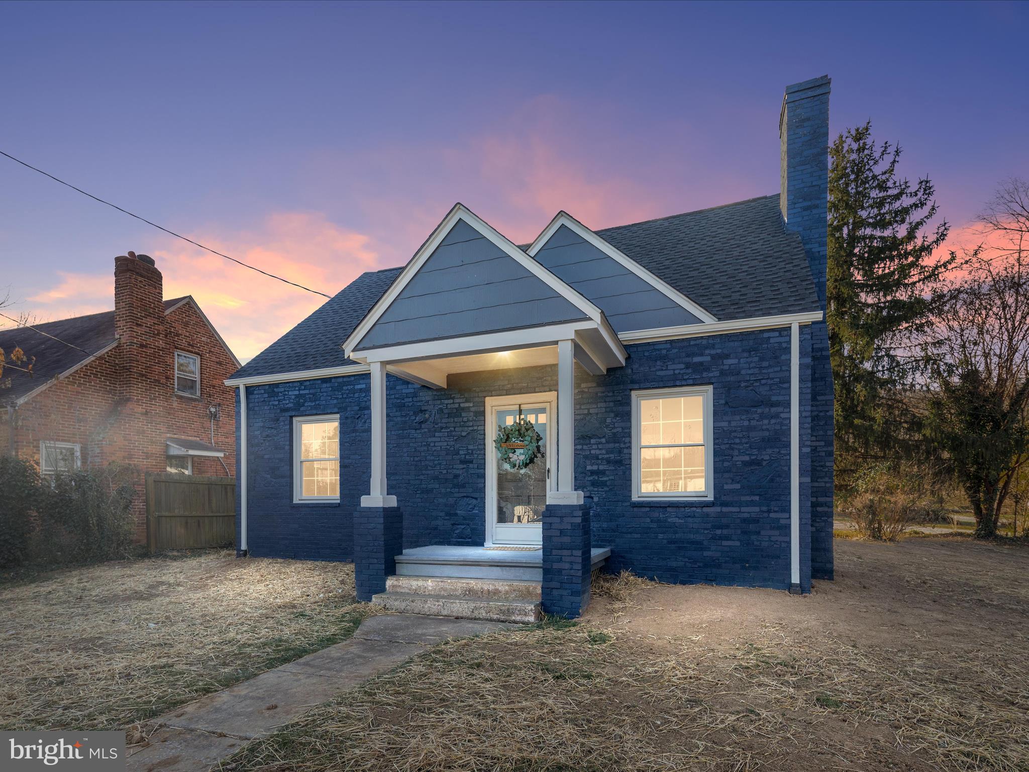 a view of a house with a yard and garage