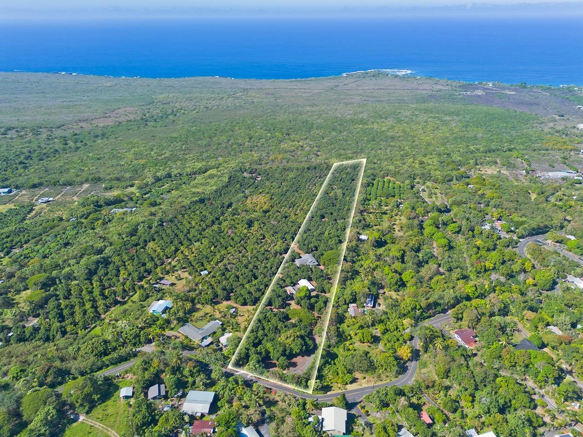 a view of a field with an ocean